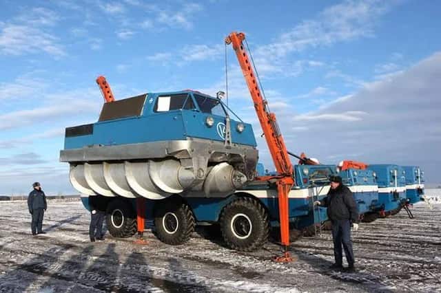 The Soviet ZIL-2906 screw-propelled vehicle advancing over snowy terrain in Siberia