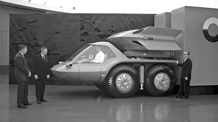 The General Motors Bison concept truck on outdoor display at the 1964 New York World's Fair, with its panoramic glass canopy and turbines mounted above the cab